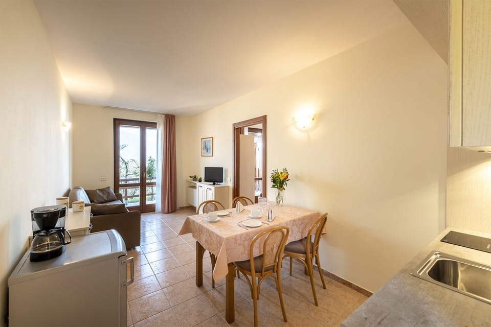 Standard Apartment, 1 Bedroom | Living area | LCD TV