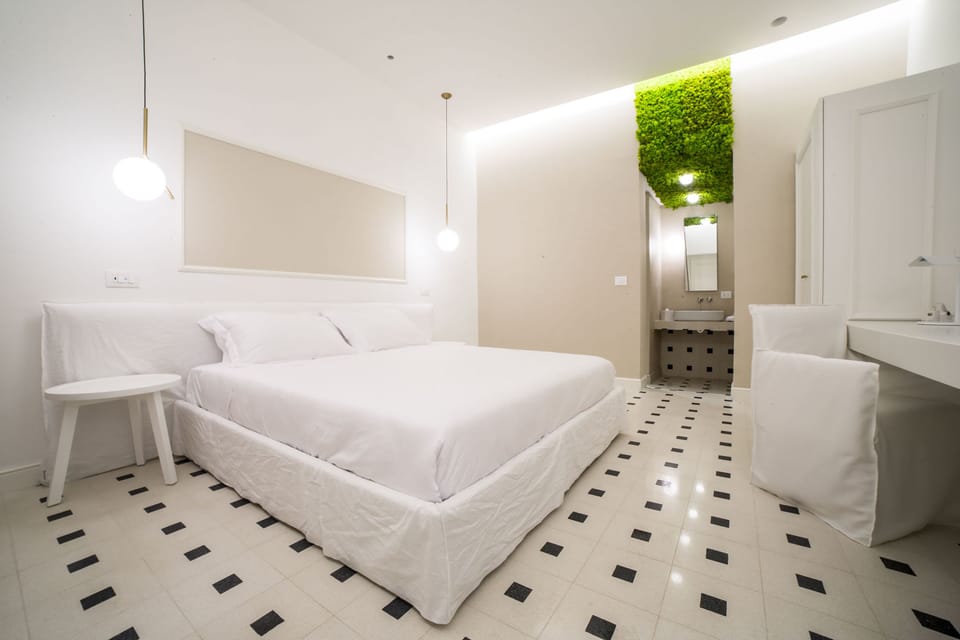 Junior Suite, 1 King Bed, Private Bathroom, Courtyard View | Minibar, in-room safe, individually decorated, individually furnished