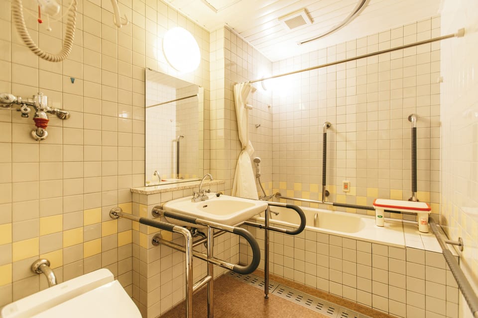 Accessible Room (With private bathroom)(Non Smoking) | Bathroom | Free toiletries, hair dryer, slippers, bidet
