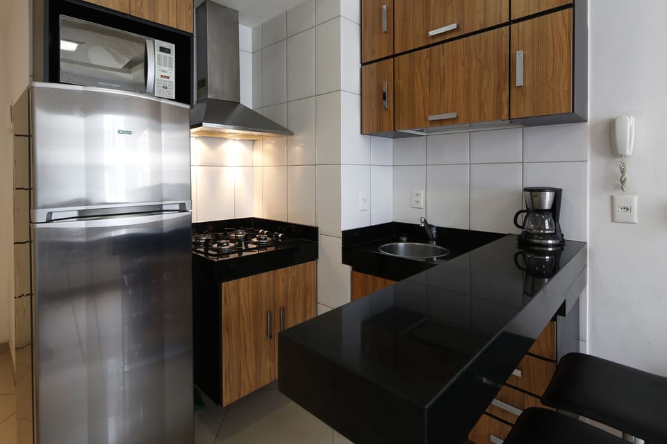 Apartment | Private kitchenette | Full-size fridge, microwave, stovetop, cookware/dishes/utensils