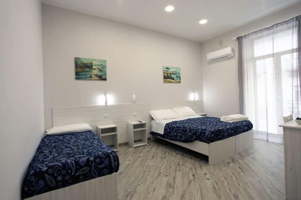 Deluxe Quadruple Room | Premium bedding, minibar, in-room safe, desk