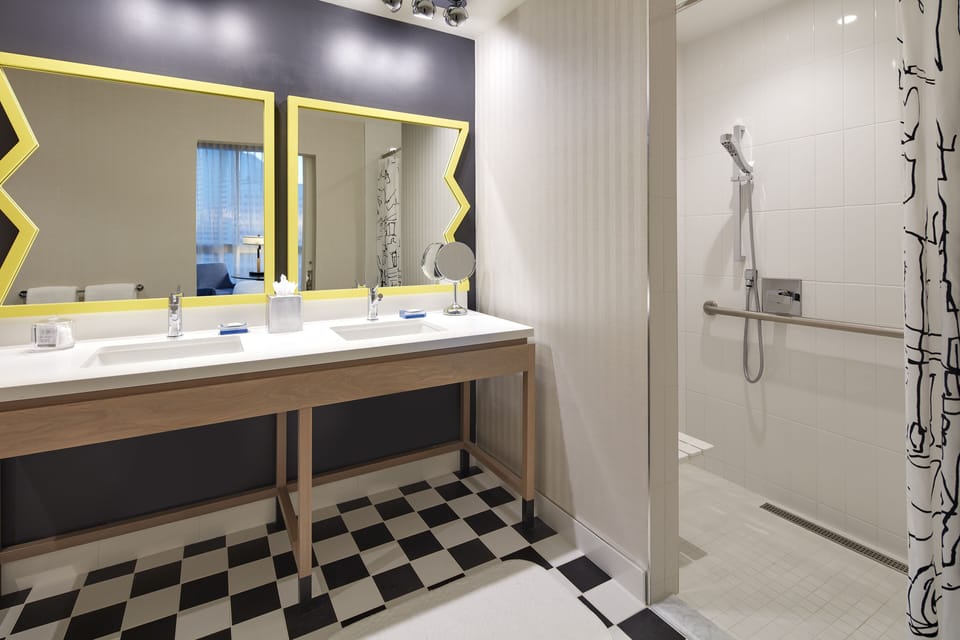 Suite, Accessible | Bathroom | Rainfall showerhead, designer toiletries, hair dryer, bathrobes