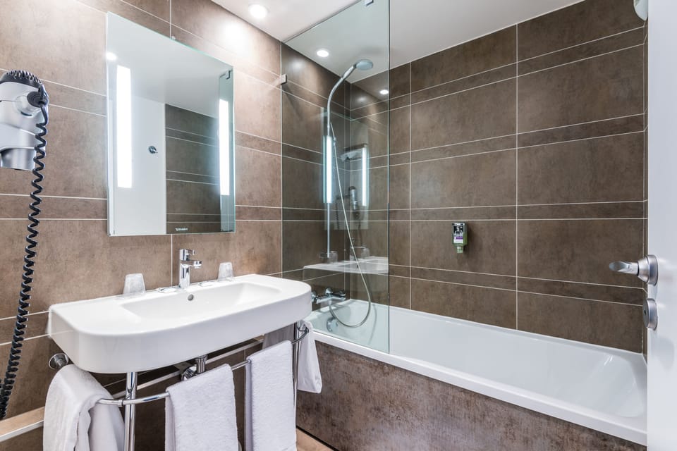 Eco-friendly toiletries, hair dryer, towels, soap
