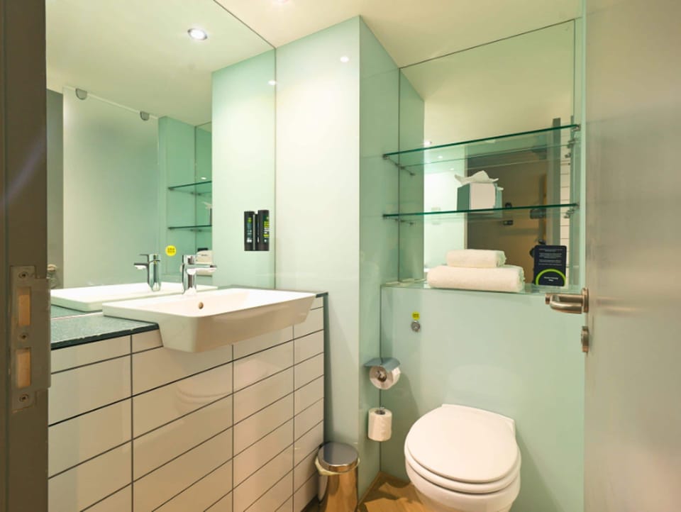 Shower, rainfall showerhead, hair dryer, towels