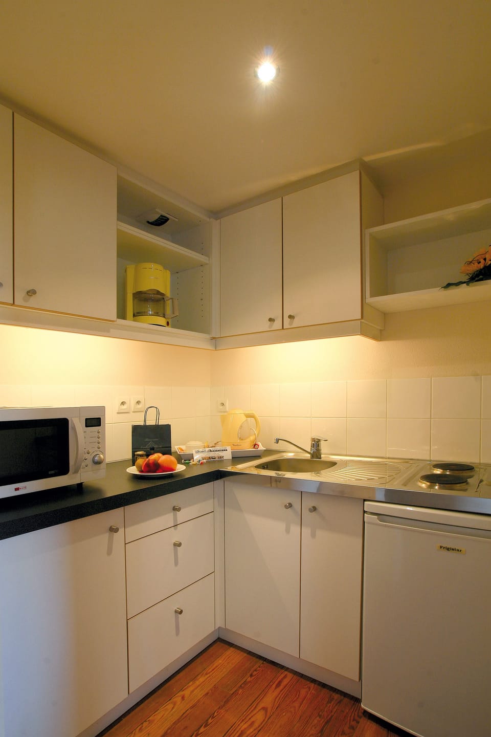 Fridge, microwave, stovetop, coffee/tea maker