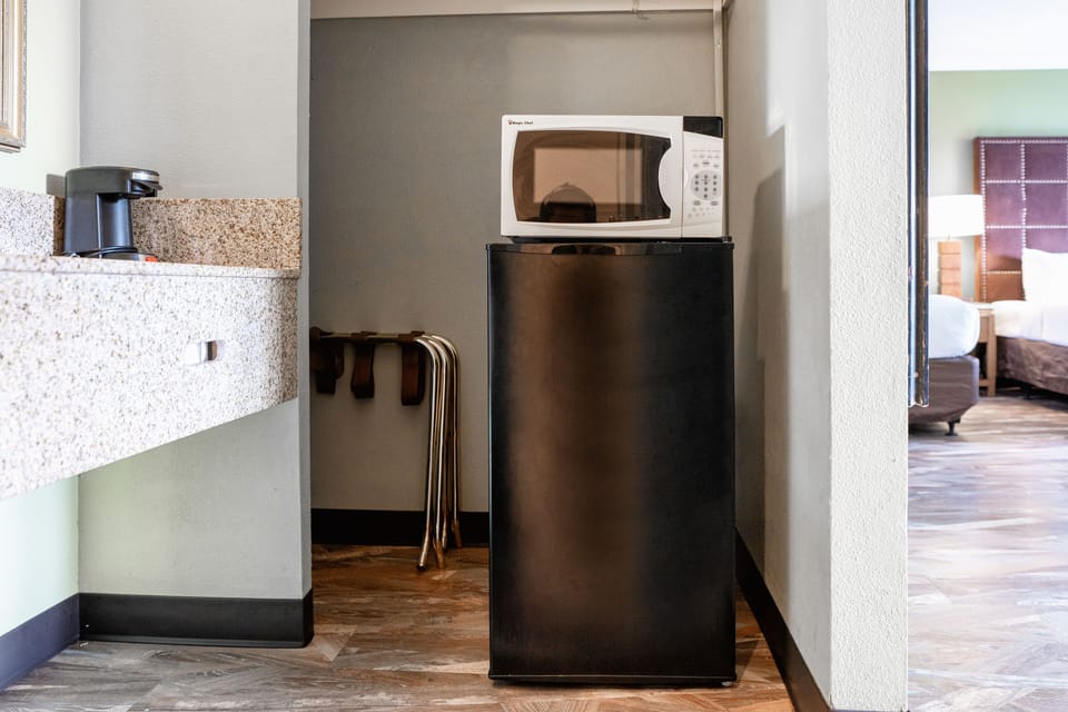 Deluxe Triple Room | Pillowtop beds, desk, laptop workspace, blackout drapes