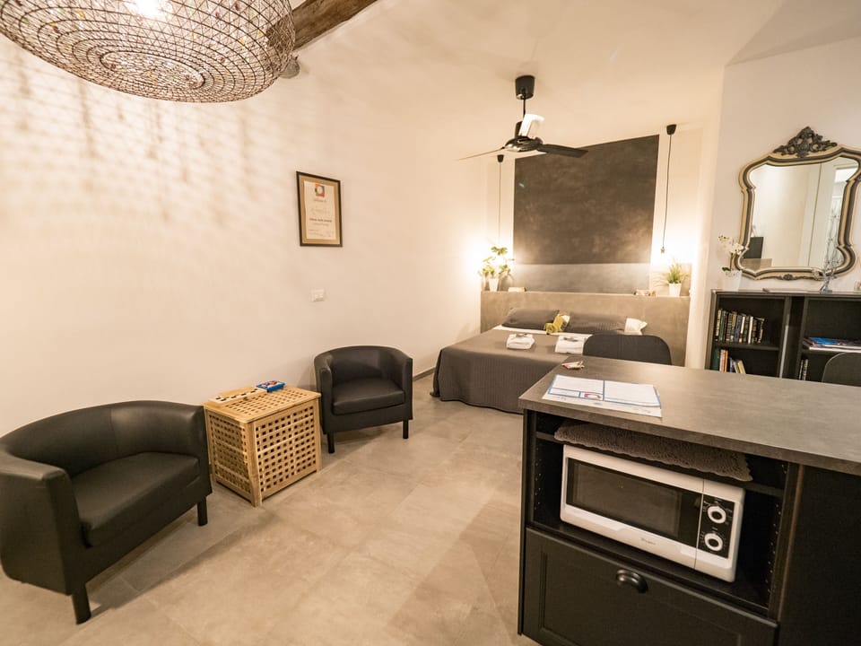 Deluxe Studio, 1 Double Bed, Air conditioning, Beachside | Living area | 43-inch Smart TV with digital channels