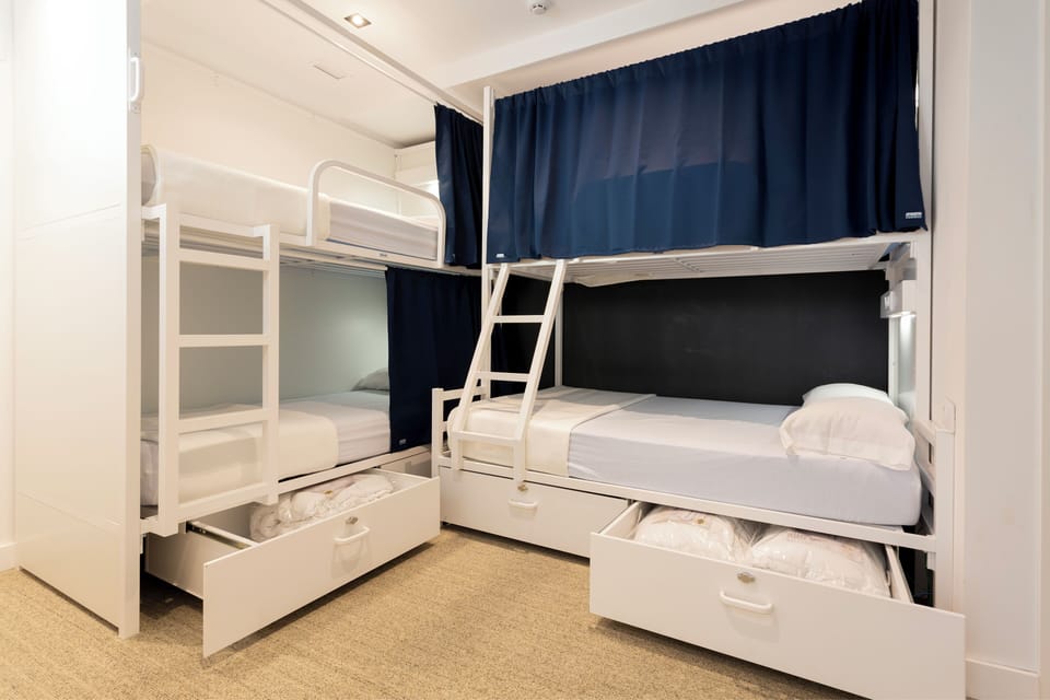 Family Room | Premium bedding, down comforters, desk, blackout drapes