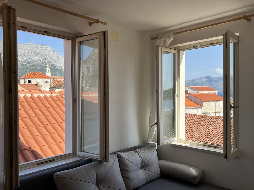 Apartment, 1 Bedroom, Sea View | Living area | Flat-screen TV