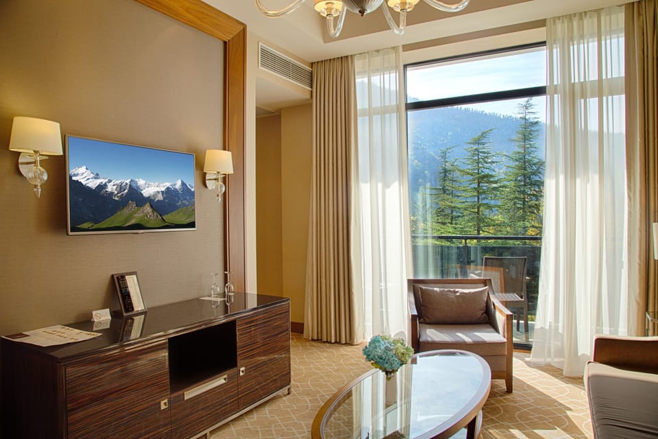 Junior Suite | Living room | 40-inch Smart TV with cable channels