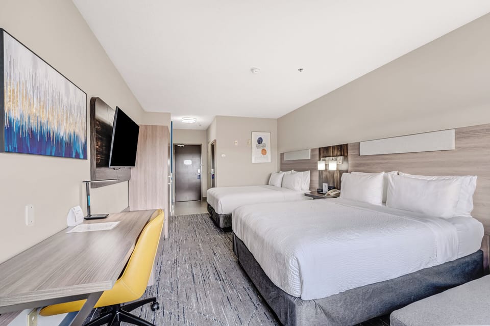 Standard Room, 2 Queen Beds | In-room safe, desk, iron/ironing board, free cribs/infant beds