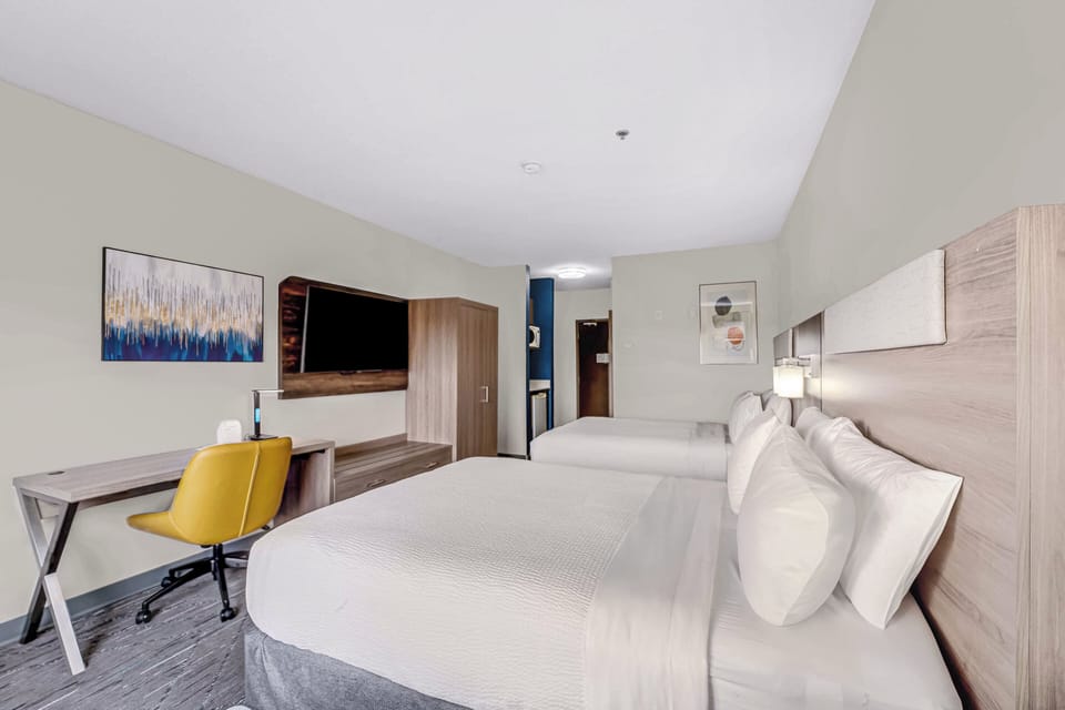 Standard Room, 2 Queen Beds | In-room safe, desk, iron/ironing board, free cribs/infant beds