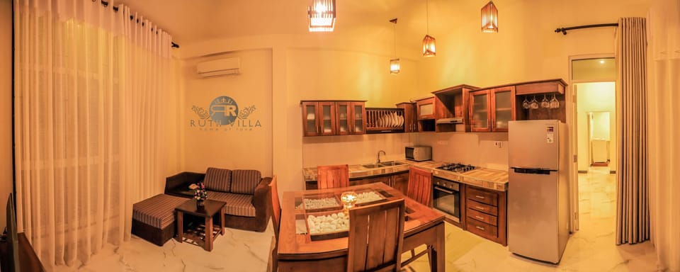 Deluxe Apartment, 1 Bedroom, Garden View | Living area | 22-inch flat-screen TV with cable channels, TV