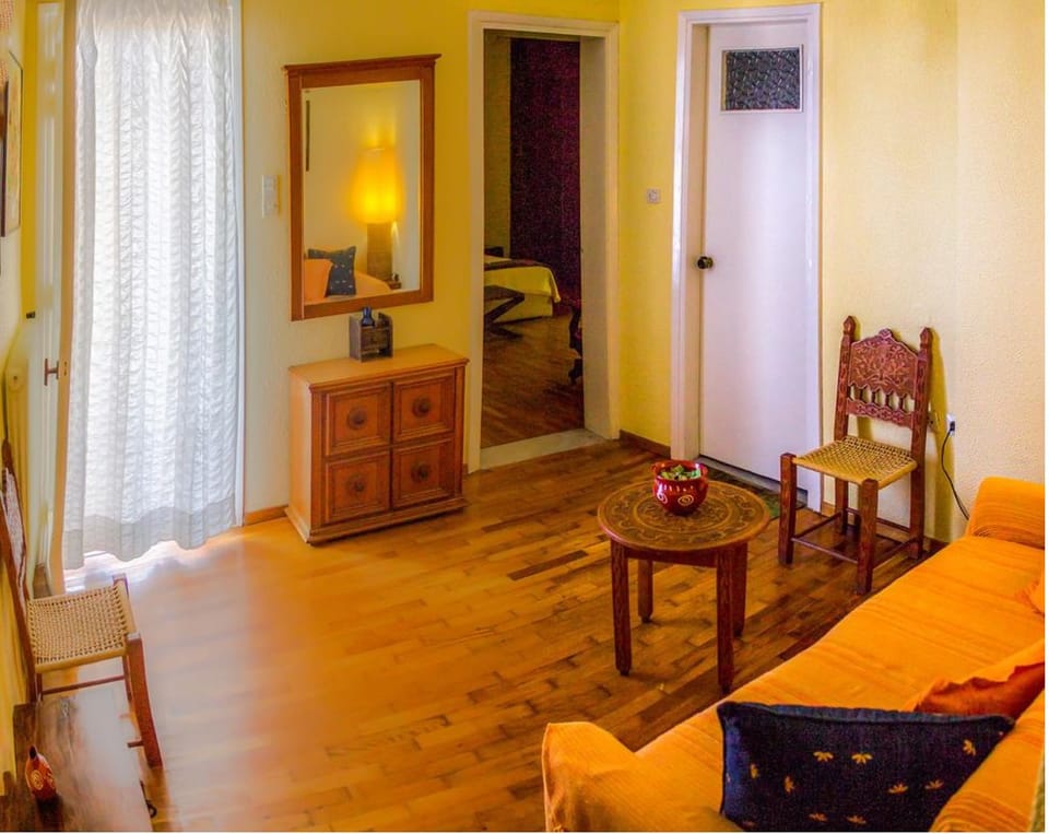 Superior Suite, City View | Living area | Flat-screen TV