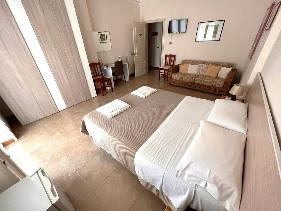Comfort Quadruple Room, 1 Queen Bed with Sofa bed | Beach | Beach nearby