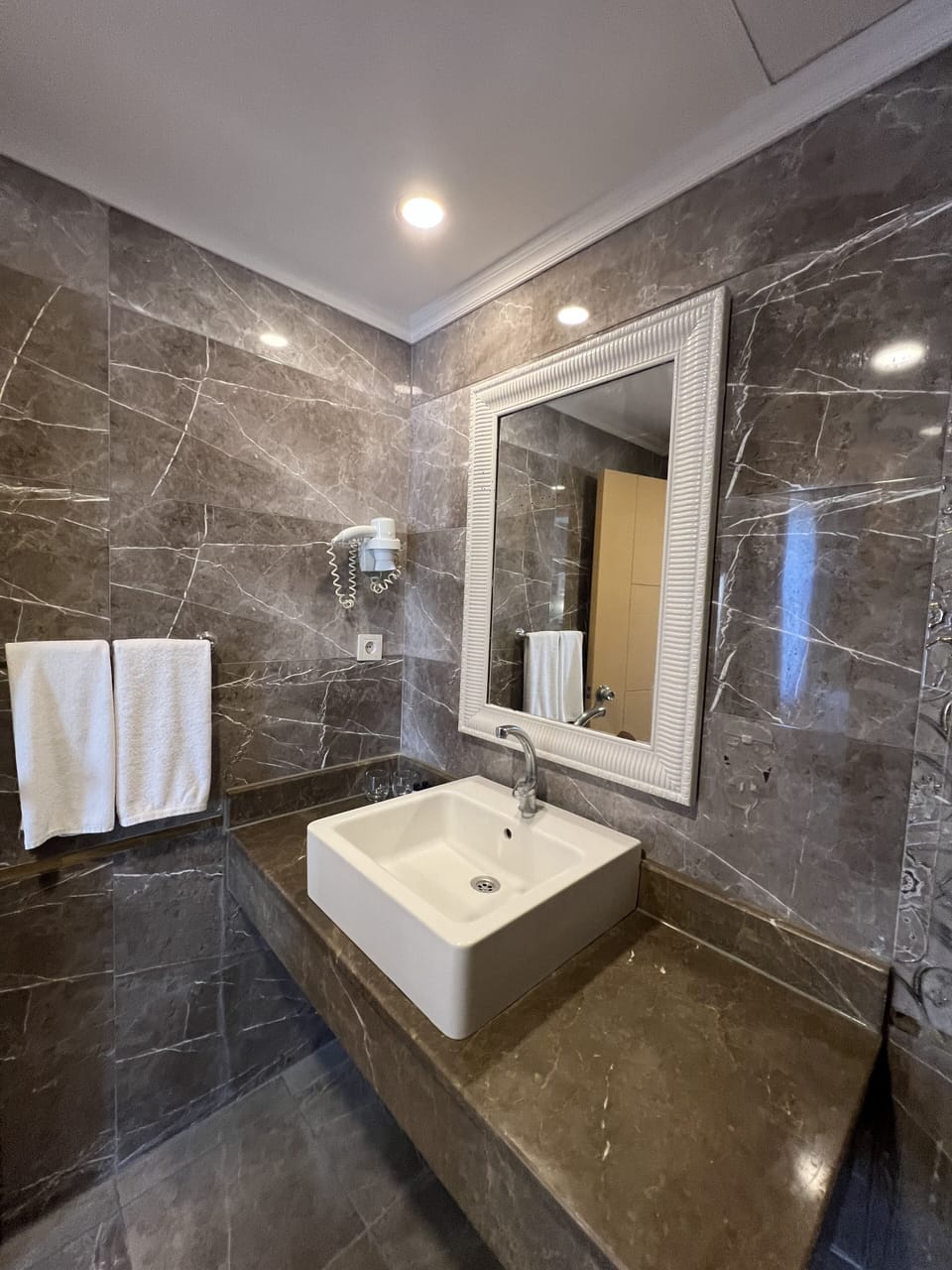 Shower, free toiletries, hair dryer, slippers