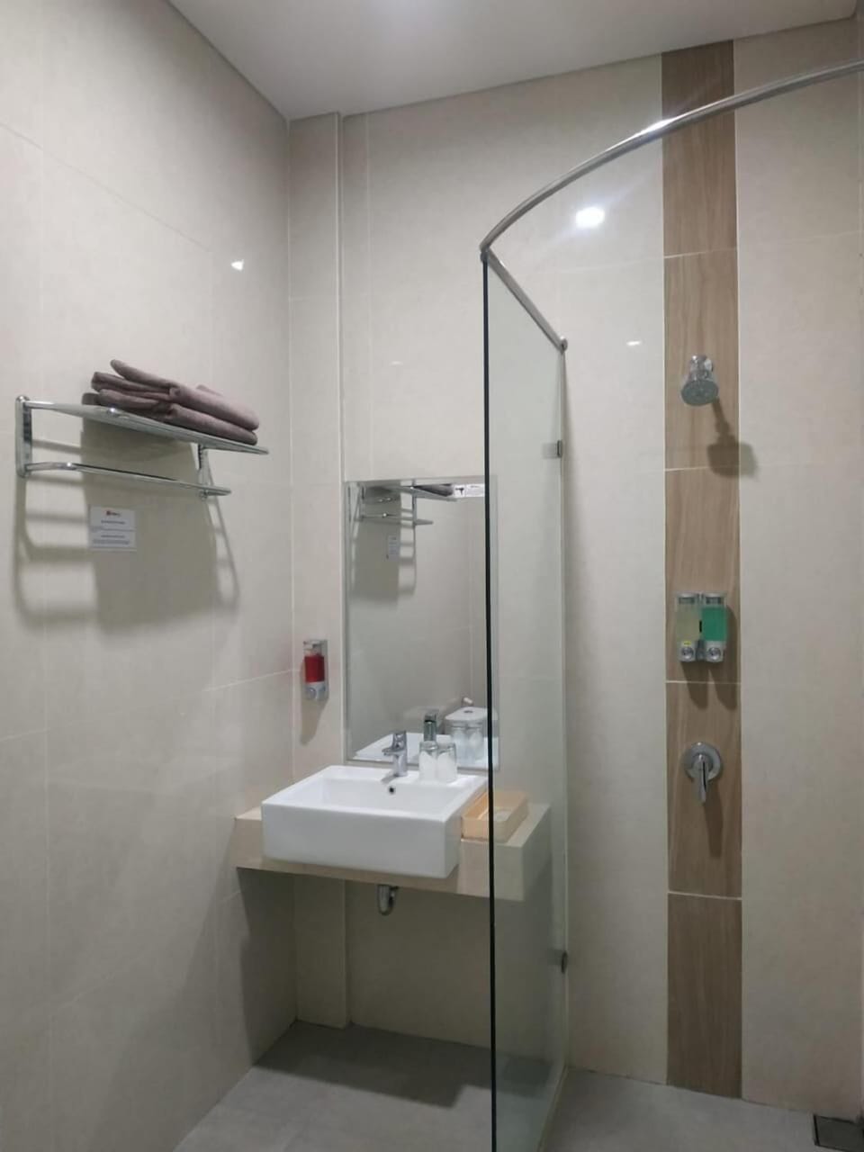 Shower, hair dryer, slippers, towels
