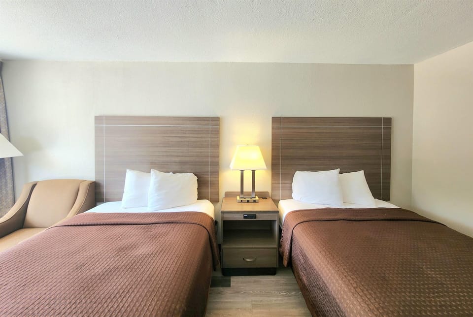 Double Room, 2 Double Beds | Iron/ironing board, cribs (free), WiFi (free), bed sheets