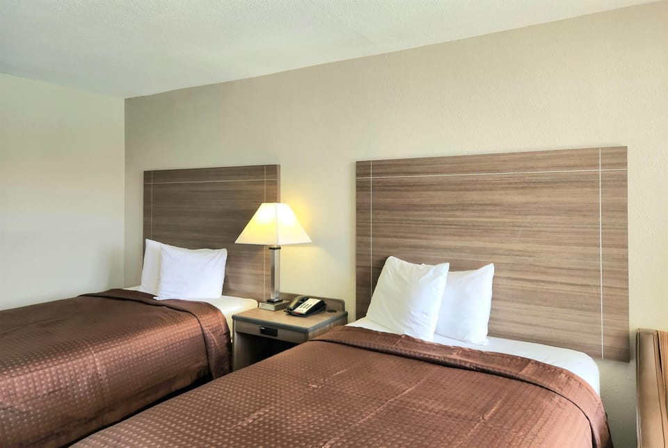 Double Room, 2 Double Beds | Iron/ironing board, cribs (free), WiFi (free), bed sheets