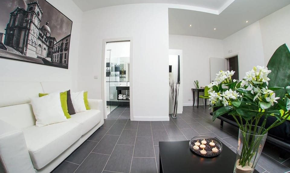 Quadruple Room | Living room | Flat-screen TV