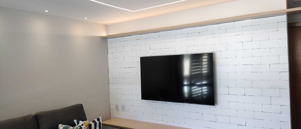 Deluxe Apartment | Living area | 50-inch flat-screen TV with satellite channels, TV