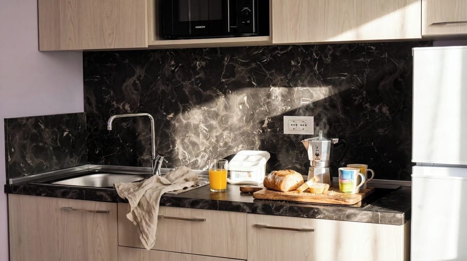Full-size fridge, microwave, stovetop, coffee grinder