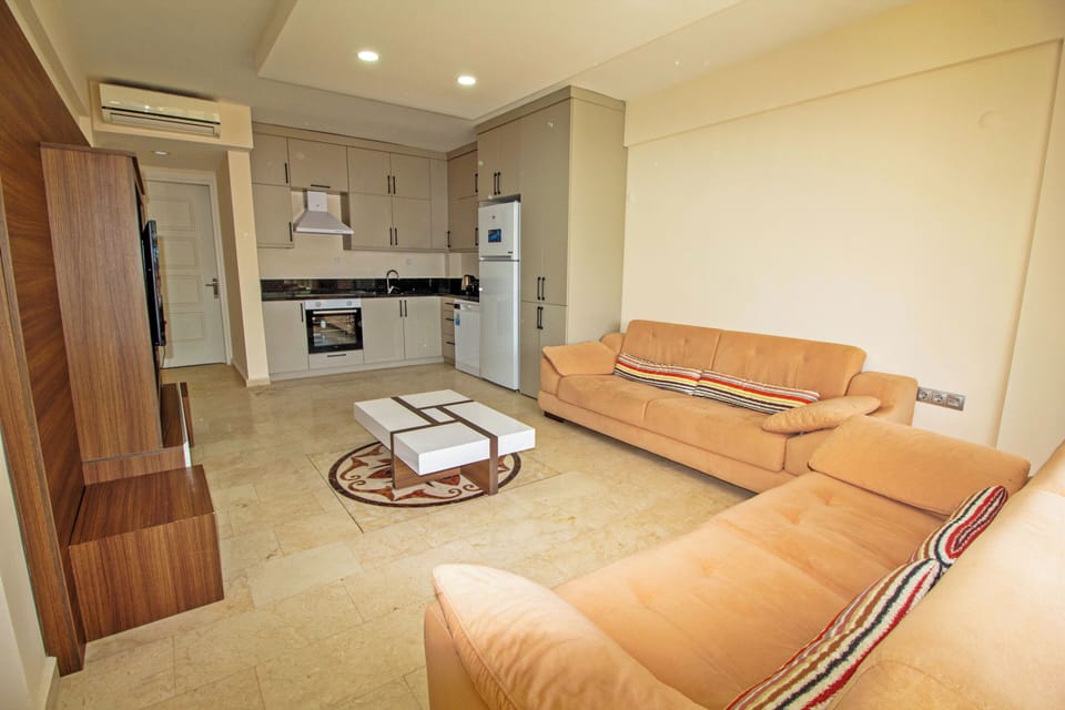 Apartment | Living area | 25-inch LCD TV with satellite channels