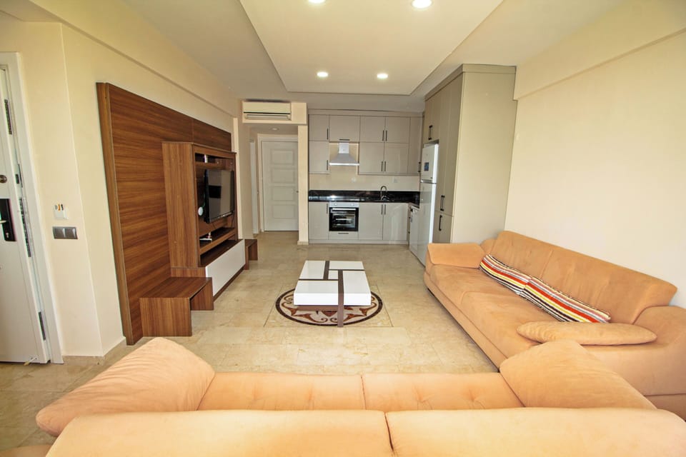 Apartment | Living area | 25-inch LCD TV with satellite channels