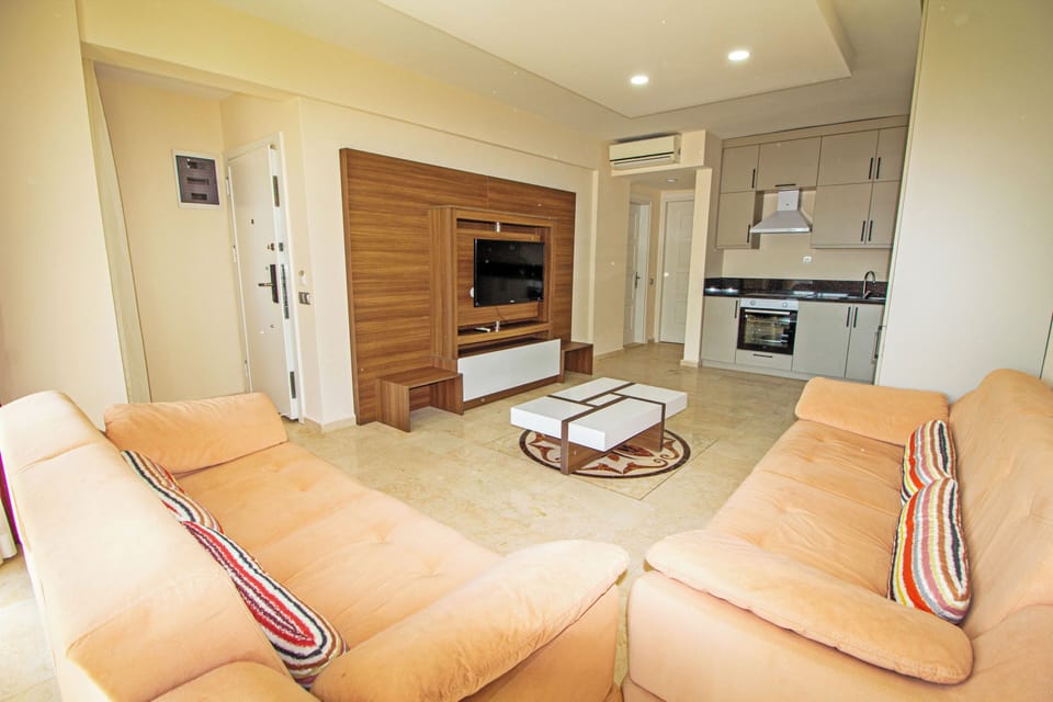 Apartment | Living area | 25-inch LCD TV with satellite channels