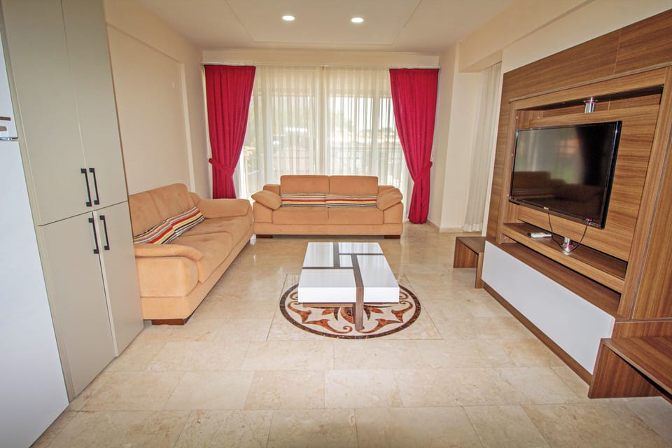 Apartment | Living area | 25-inch LCD TV with satellite channels