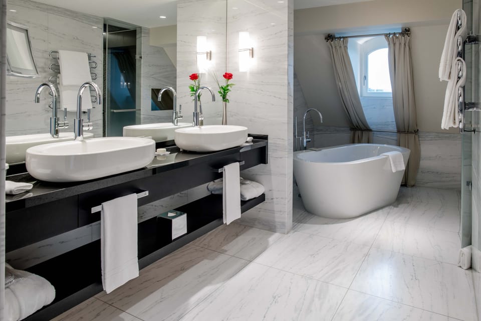 Signature Suite | Bathroom | Rainfall showerhead, designer toiletries, hair dryer, bathrobes