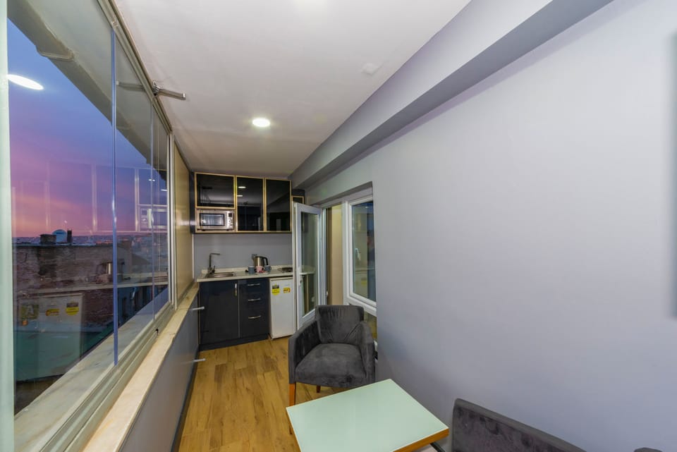 C) Suite with Terrace | Private kitchen | Fridge, microwave, stovetop, electric kettle