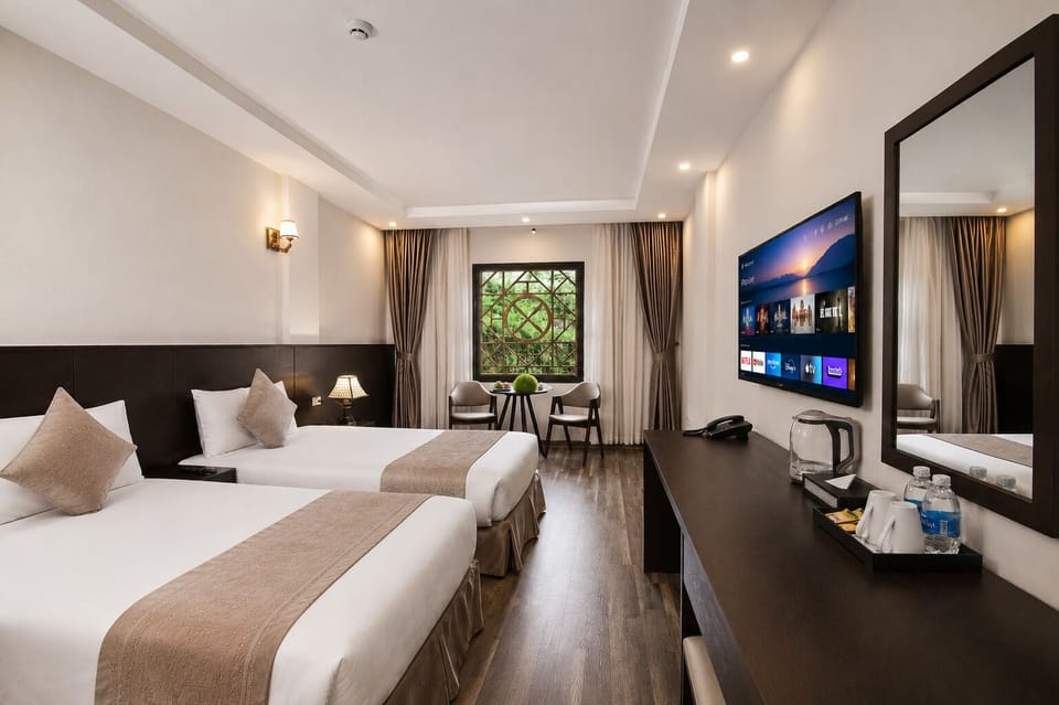 Superior Twin Room | Minibar, desk, laptop workspace, blackout drapes