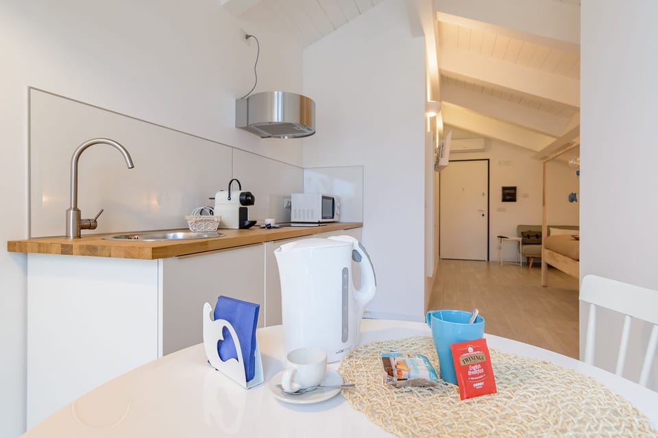 Comfort Apartment (Maestrale) | Private kitchen | Fridge, microwave, stovetop, coffee/tea maker