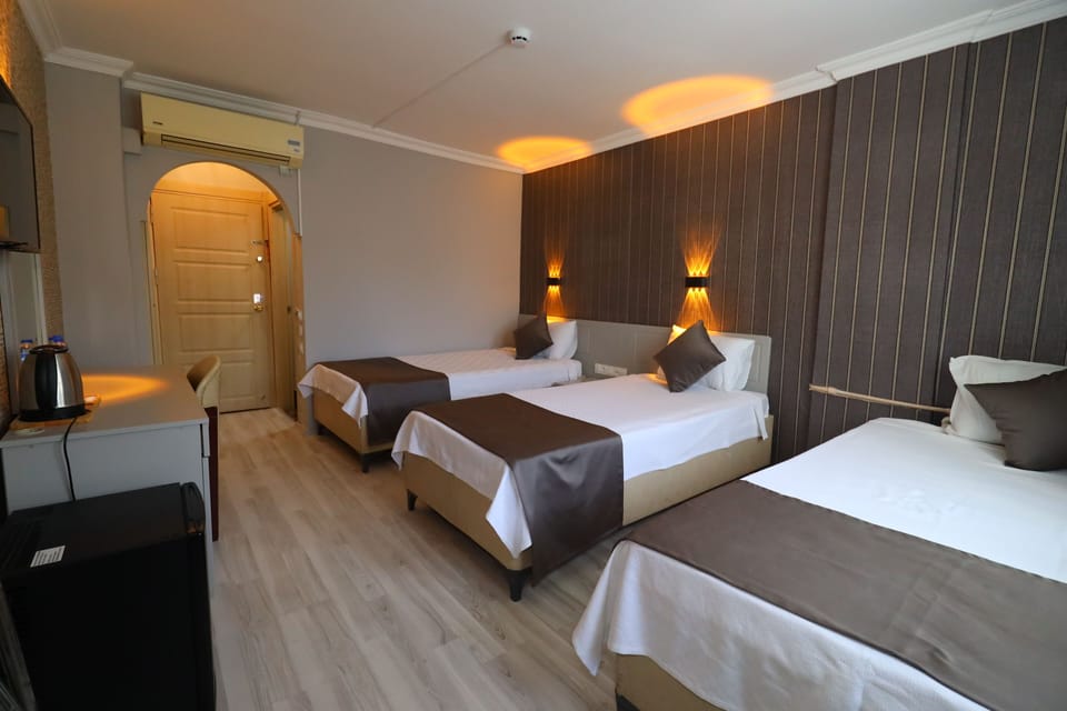 Standard Triple Room, 3 Twin Beds | Premium bedding, in-room safe, laptop workspace, soundproofing