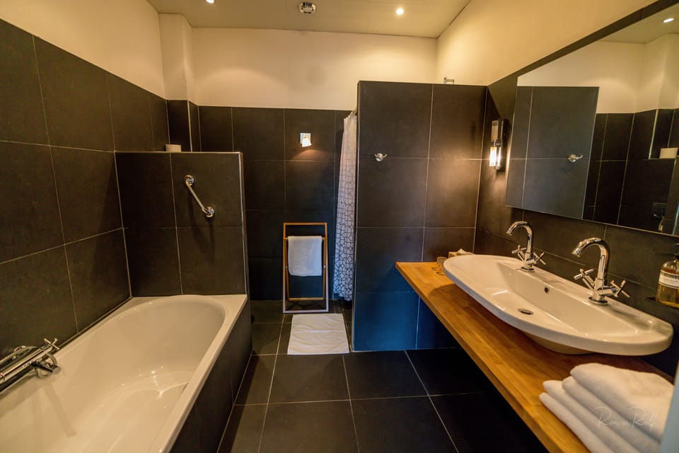 Suite | Bathroom | Rainfall showerhead, free toiletries, hair dryer, bathrobes
