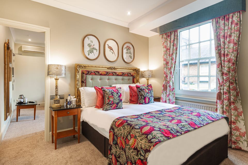 Deluxe Family Room | Premium bedding, desk, blackout drapes, iron/ironing board