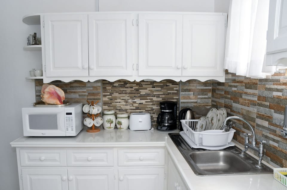 Apartment, Garden View | Private kitchen | Full-size fridge, microwave, oven, stovetop