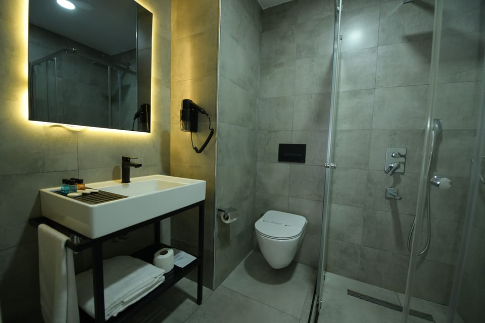 Shower, free toiletries, hair dryer, slippers