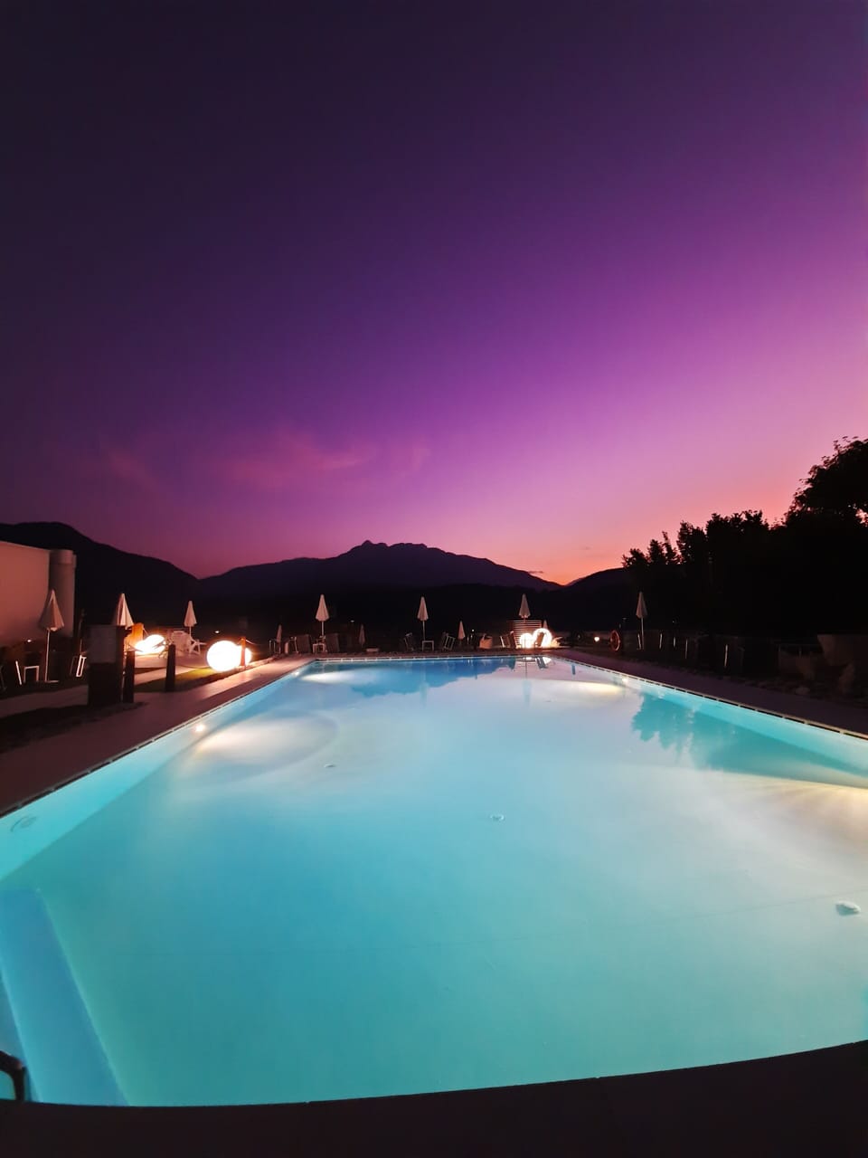 Seasonal outdoor pool, a waterfall pool, pool umbrellas, sun loungers