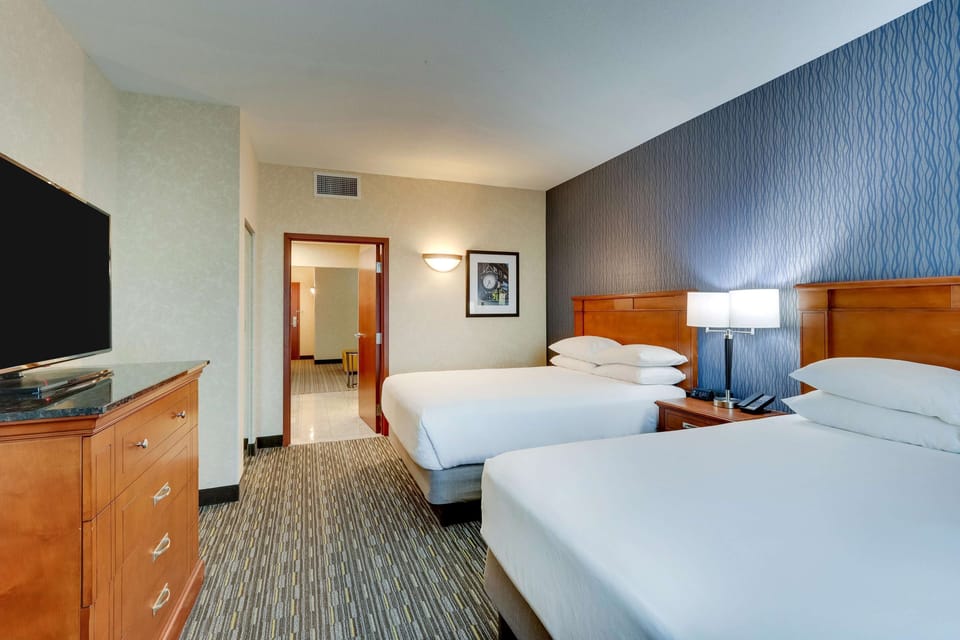 Desk, blackout drapes, iron/ironing board, free cribs/infant beds