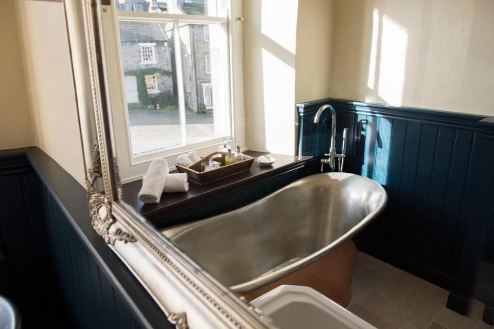 Shower, designer toiletries, hair dryer, bathrobes