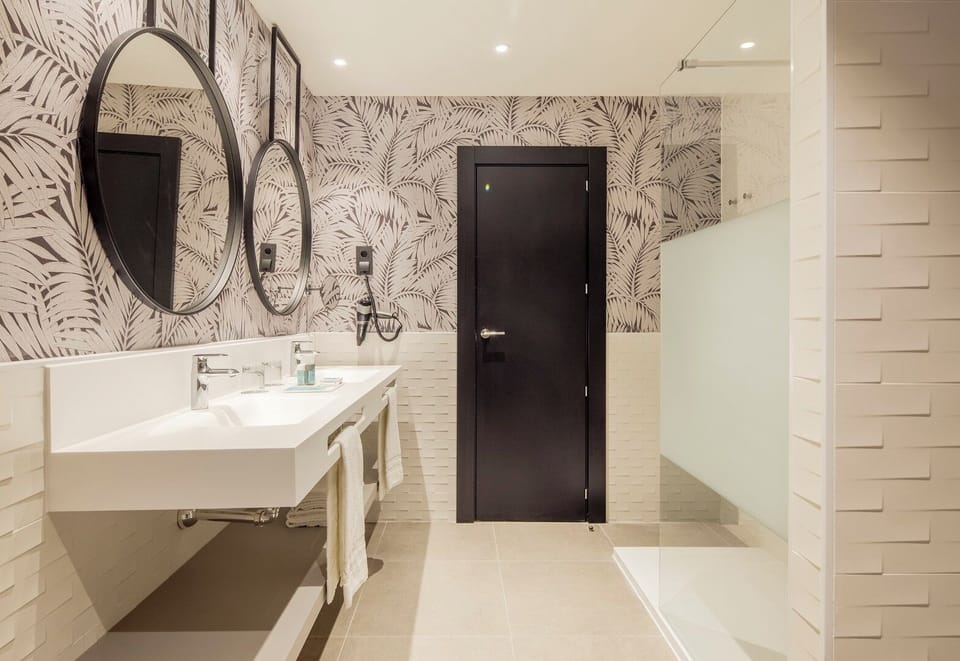 Eco-friendly toiletries, hair dryer, bidet, towels