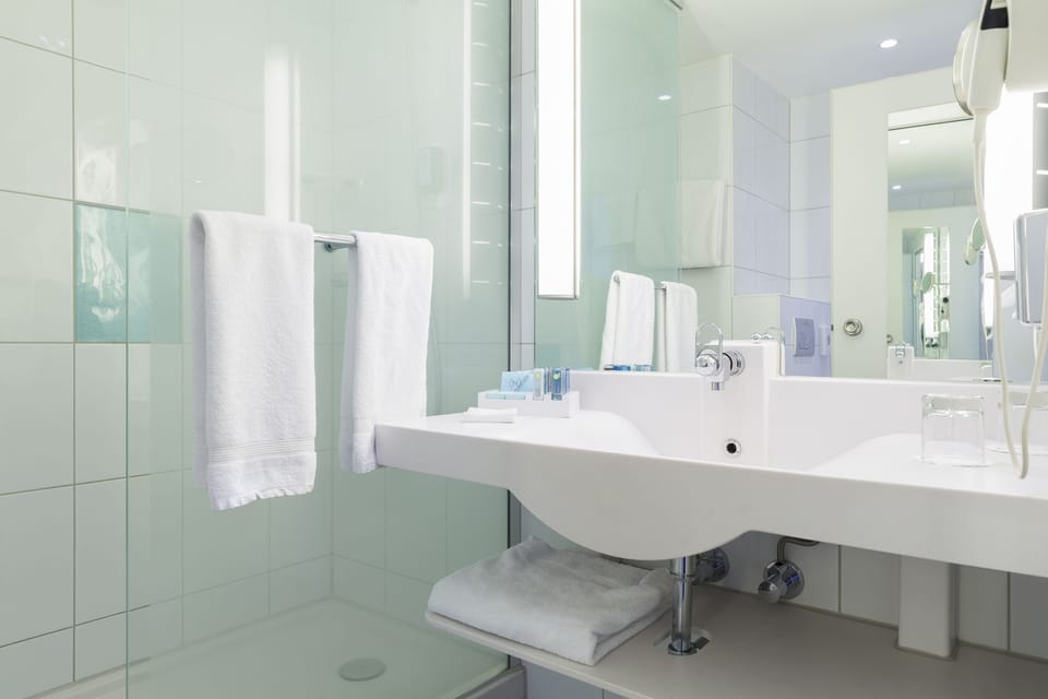 Eco-friendly toiletries, hair dryer, towels