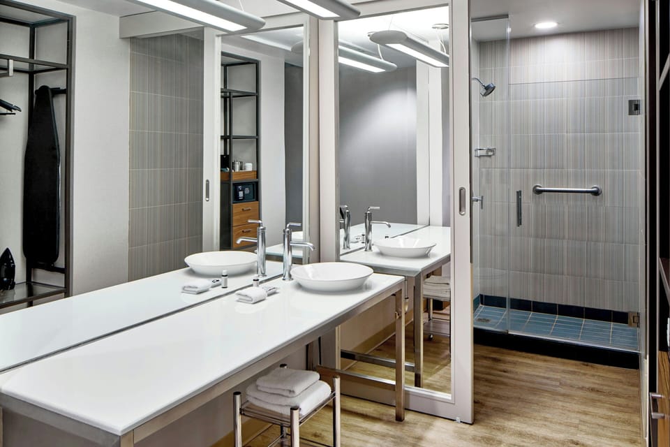 Designer toiletries, hair dryer, towels
