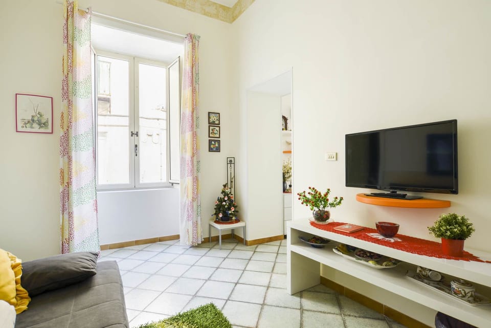 Deluxe Apartment, City View | Living area | Flat-screen TV