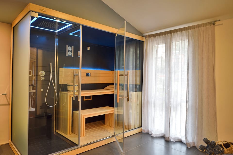 Luxury Suite, 1 King Bed, Jetted Tub | Bathroom | Shower, jetted tub, rainfall showerhead, designer toiletries