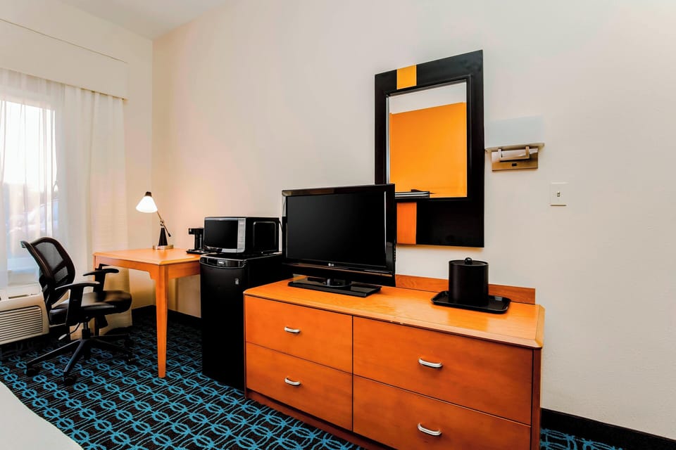 Hypo-allergenic bedding, down comforters, desk, laptop workspace
