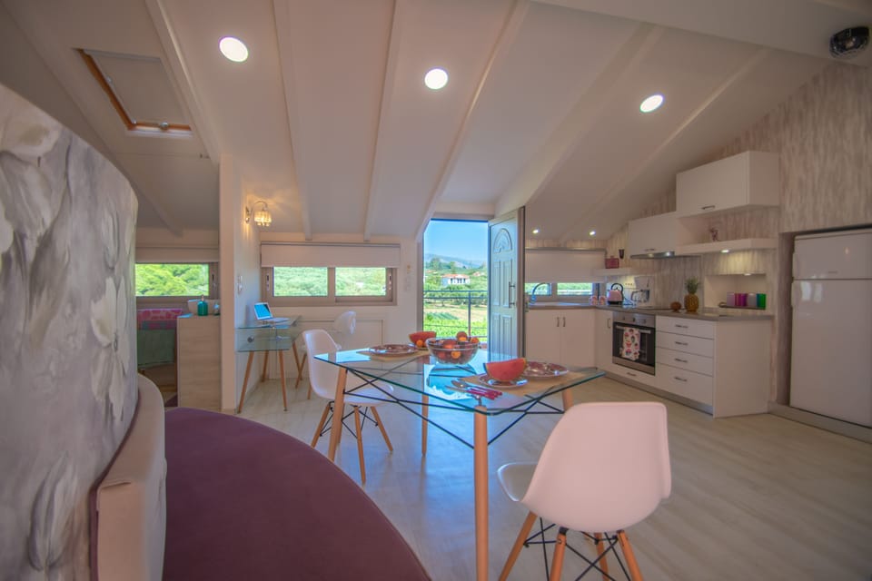Luxury Loft, Partial Sea View | Living area | Flat-screen TV