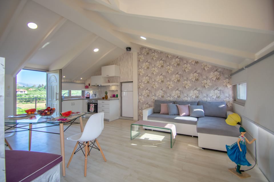 Luxury Loft, Partial Sea View | Living room | Flat-screen TV